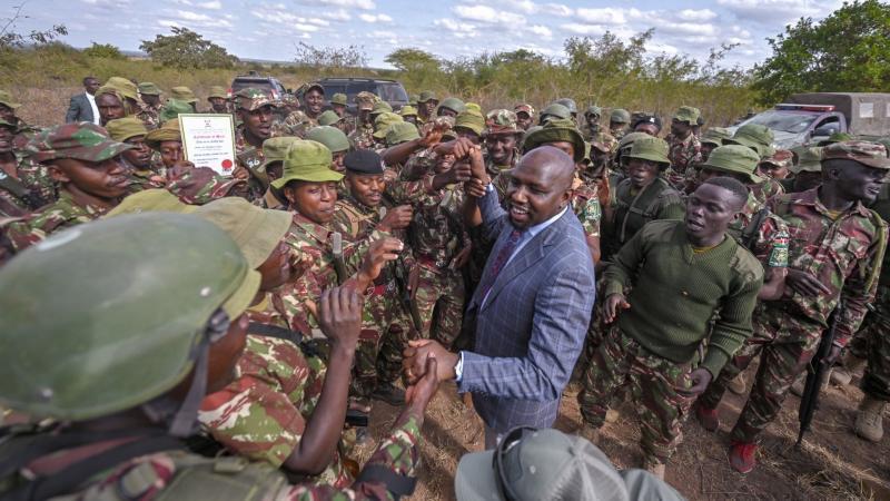 File image of Interior Cabinet Secretary Kipchumba Murkomen interacting with police officers